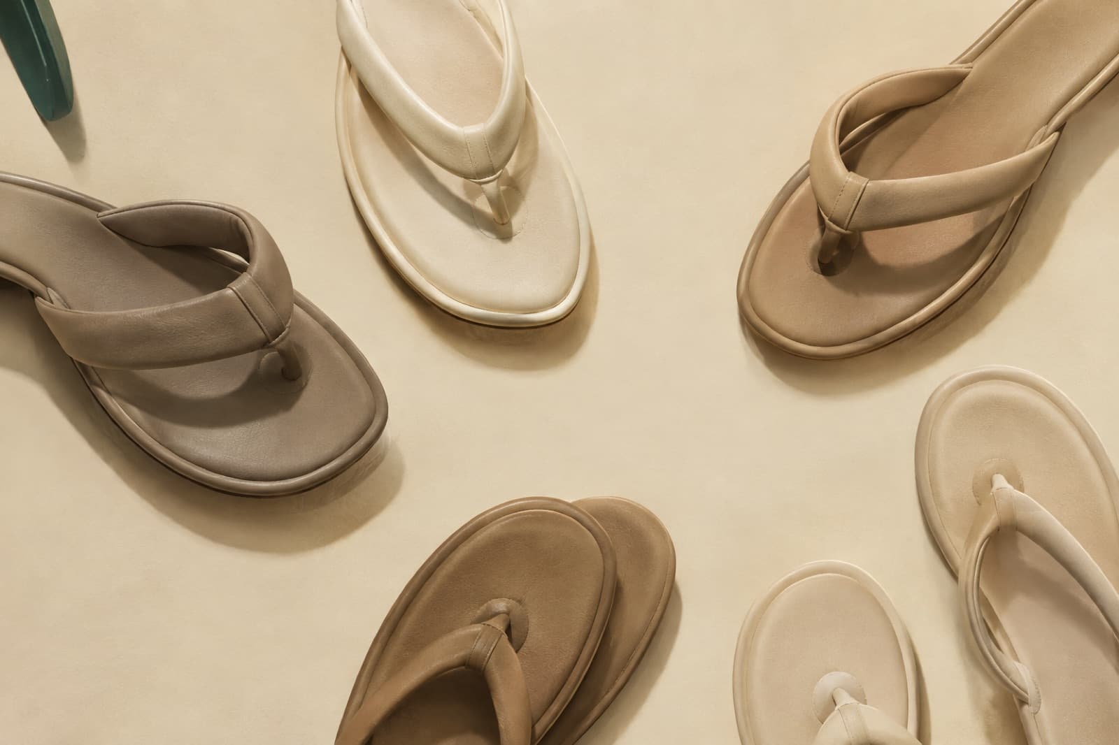 Toe-post sandals seen from above with the posts and their sleeves visible