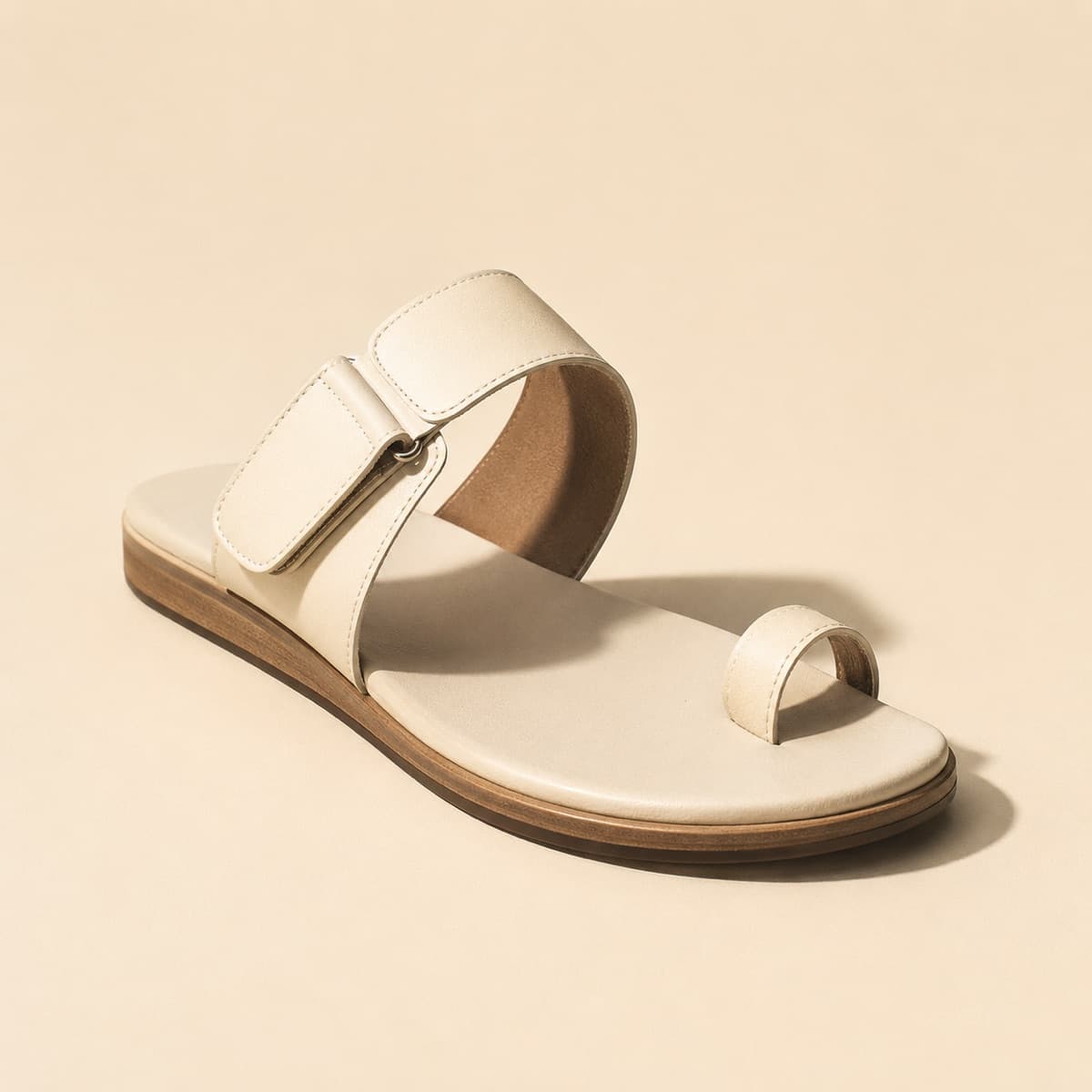 High Instep Fit, photographed from above against a sand-beige background