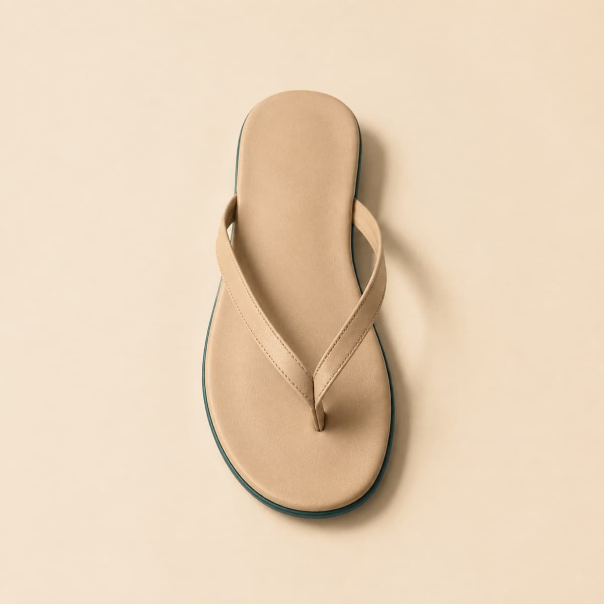 Toe-Post Basic, photographed from above against a sand-beige background